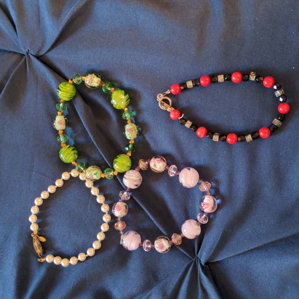 Set of four costume jewelry bracelets